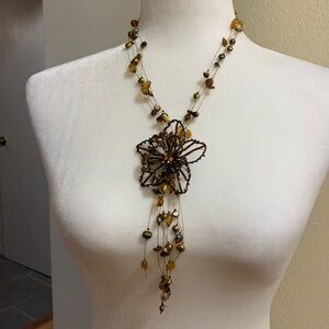 Delicate multi strand wire necklace with crystal and gold beads.